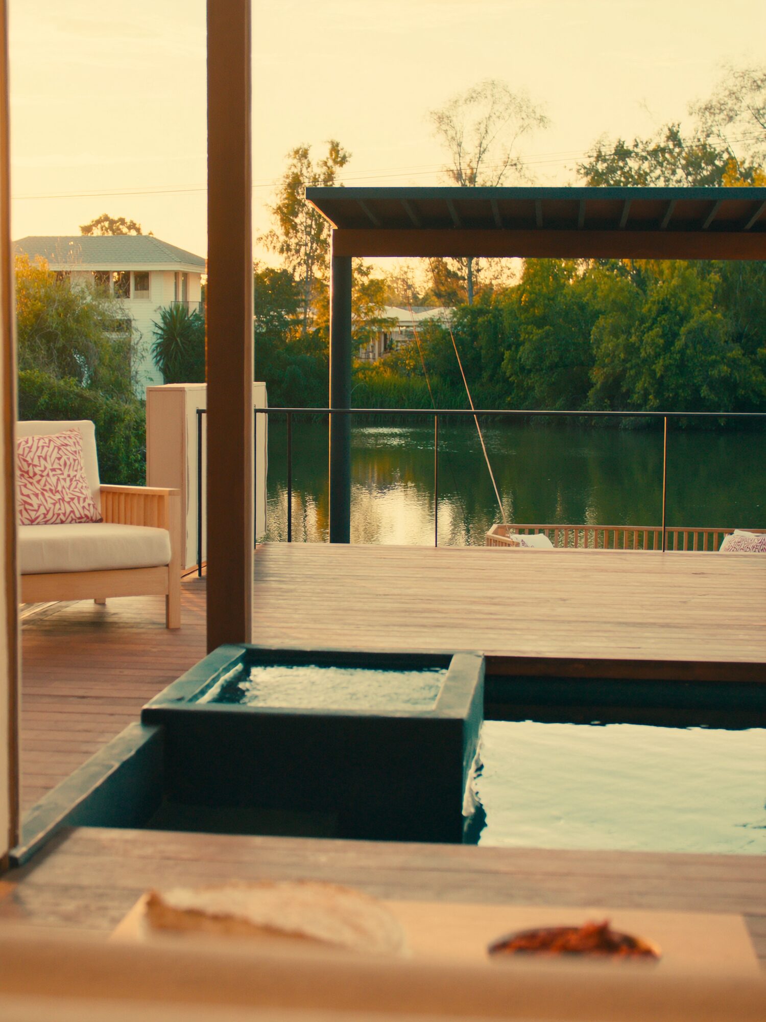 Covered verandah and pool deck set up for a slow tropical evening