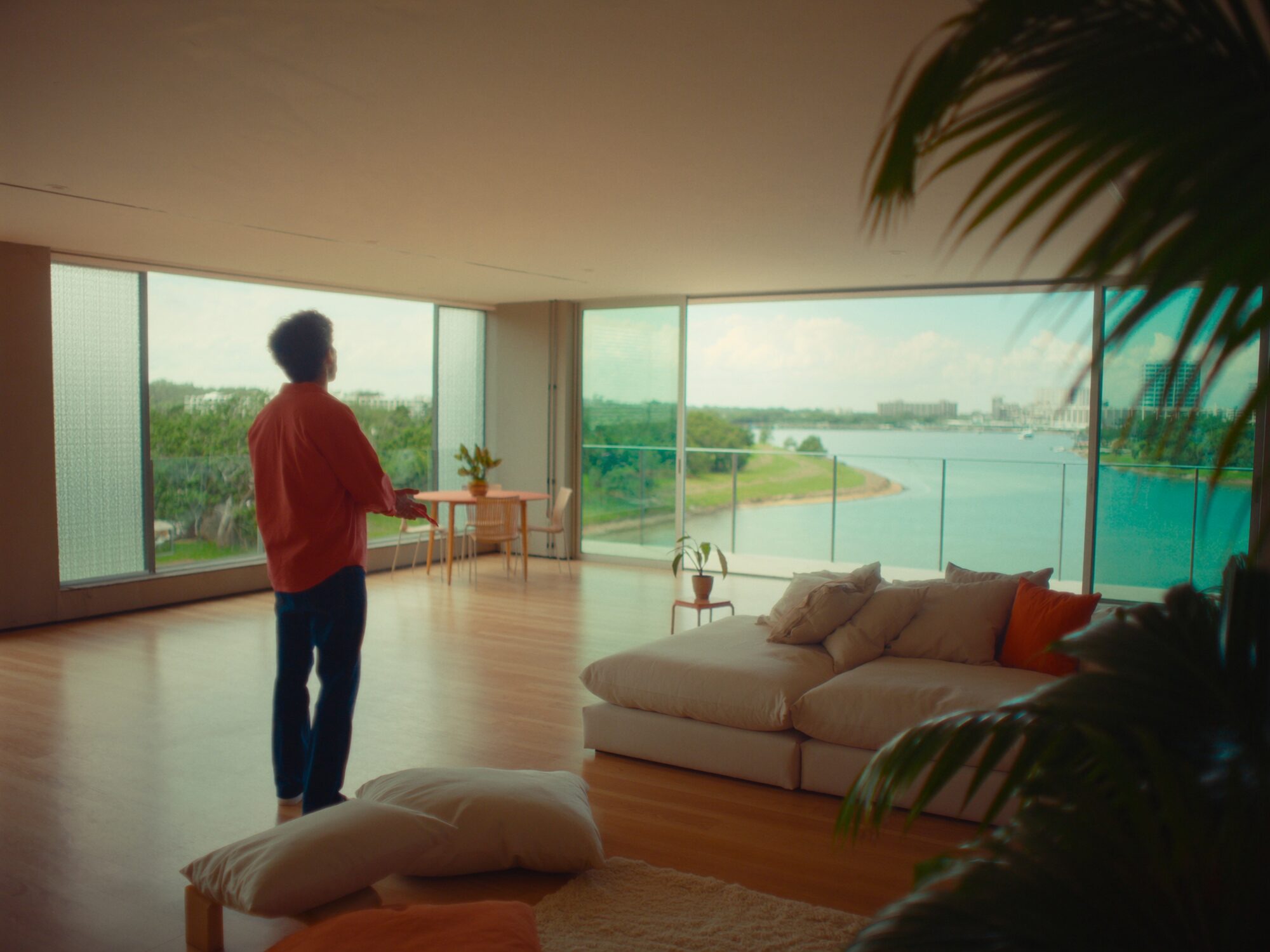 Open-plan apartment living room overlooking the Darwin Waterfront recreation lagoon